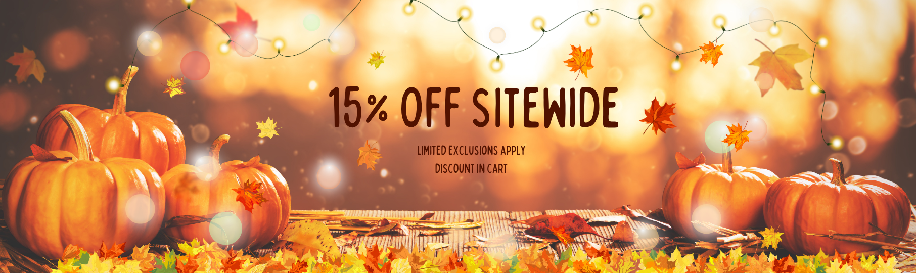 Promotional banner with pumpkins and a discount message (15% off sitewide, limited exclusions apply) on a warm, blurred background.